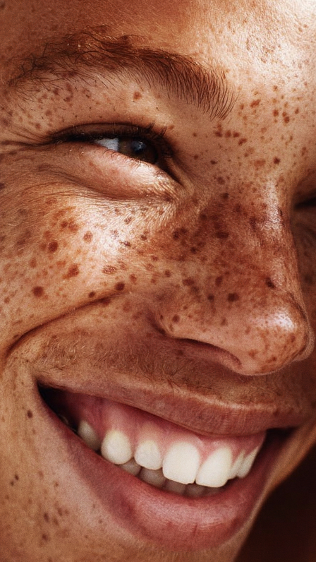 Smiling face with freckles